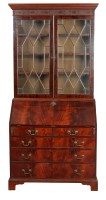 Lot 1352 - A mahogany bureau bookcase, the later top with...