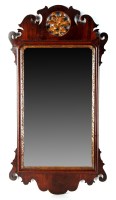 Lot 1354 - A Georgian mahogany parcel gilt wall mirror,...