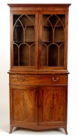 Lot 1367 - A Georgian mahogany bookcase and cupboard, the...