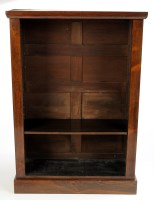 Lot 1373 - A rosewood open bookcase, with moulded top...