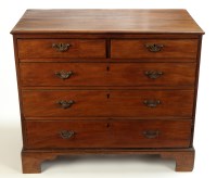 Lot 1387 - A Georgian mahogany chest of two short and...