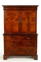 Lot 1393 - An early 18th Century walnut cupboard-on-chest,...