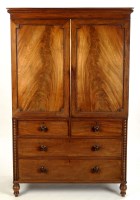 Lot 1395 - A late Georgian mahogany linen press, with a...