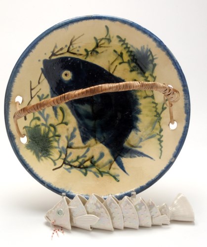Lot 29 - A glazed stoneware bowl, decorated with fish,...