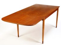 Lot 54 - A rectangular teak extending dining table,...