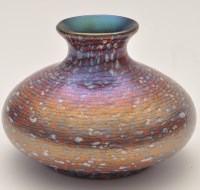 Lot 1008 - Okra: an iridescent circular squat vase,...
