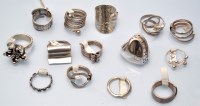 Lot 1092 - Fourteen silver rings, various designs.
