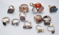 Lot 1095 - Twelve gem set silver rings.