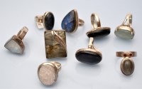 Lot 1097 - Nine gem set rings on silver shanks.