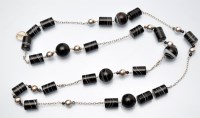 Lot 1105 - Hoorieh Coish: a banded agate and silver bead...