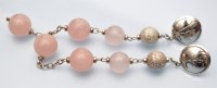 Lot 1108 - Hoorieh Coish: a pair of rose quartz and...
