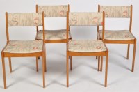Lot 1139 - A set of four 1980's teak dining chairs, the...