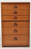 Lot 1158 - A 1970's stained wood chest of six long...