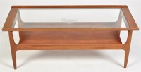 Lot 1163 - A 1970's teak coffee table, the glazed top...