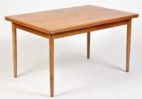 Lot 1178 - A teak draw leaf dining table, raised on...