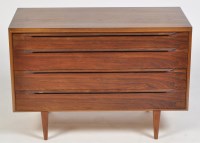 Lot 1181 - Heals: a dark stained teak chest of four long...