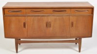 Lot 1189 - G-Plan: a teak sideboard, fitted three drawers...