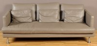 Lot 1225 - BoConcept: a grey leather three-seater sofa,...