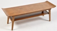 Lot 1228 - A teak coffee table, the rectangular top above...