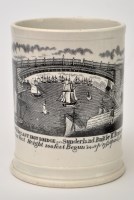 Lot 103 - Printed pearl ware frog mug of 'North East'...