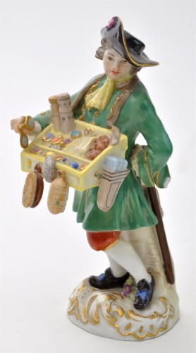 Lot 147 - Porcelain figure of a trinket seller, probably...