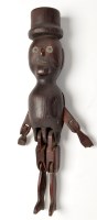 Lot 298 - A 19th Century carved and stained pine folk...