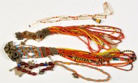 Lot 335 - Two Naga Tribe coloured beadwork and bell...
