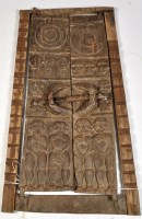 Lot 352A - A pair of Naga Tribe morung doors, carved with...