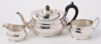Lot 410 - A George V silver three-piece tea service, by...