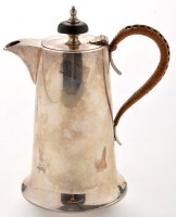 Lot 412 - A George V silver hot milk jug, by Walker &...