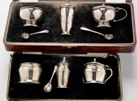 Lot 425 - A George V silver condiment set, by Reid &...