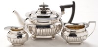 Lot 490 - A George V silver three-piece tea service, by...