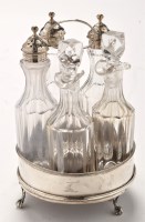 Lot 502 - A George III silver and glass cruet set, by...