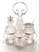 Lot 521 - An Edwardian four bottle cruet stand, by...