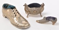 Lot 546 - An Edwardian shoe pattern silver pin cushion,...