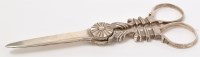 Lot 550 - A pair of George III silver grape scissors, no...