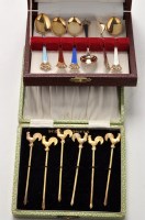 Lot 574 - Six silver gilt and enamelled coffee spoons,...