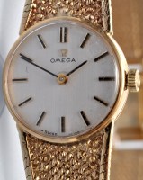 Lot 628 - Omega: a ladies's 9ct. gold wristwatch and...