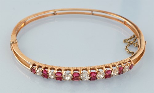 Lot 655 - A ruby and diamond bangle, c.1900, the seven...