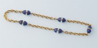 Lot 660 - A yellow metal lapis lazuli and rock crystal...