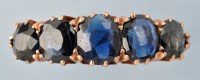 Lot 662 - A five stone sapphire ring, the graduated oval...