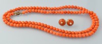 Lot 666 - A graduated coral bead necklace, 68cms long;...