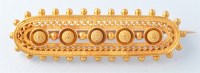 Lot 669 - A Victorian etruscan style brooch, of oval...