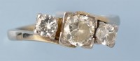 Lot 677 - A three stone diamond ring, the graduated...