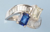 Lot 678 - A sapphire and diamond ring, the emerald cut...