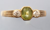 Lot 684 - A peridot and diamond ring, the octagonal...