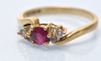 Lot 685 - A ruby and diamond ring, the circular facet...