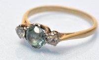 Lot 687 - A blue stone and diamond ring, the light blue...