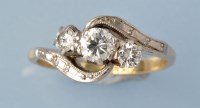 Lot 688 - A three stone diamond ring, the three...