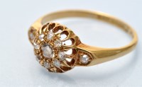 Lot 692 - A diamond cluster ring, the central diamond...